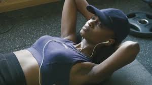 black lady excercising listening to business info